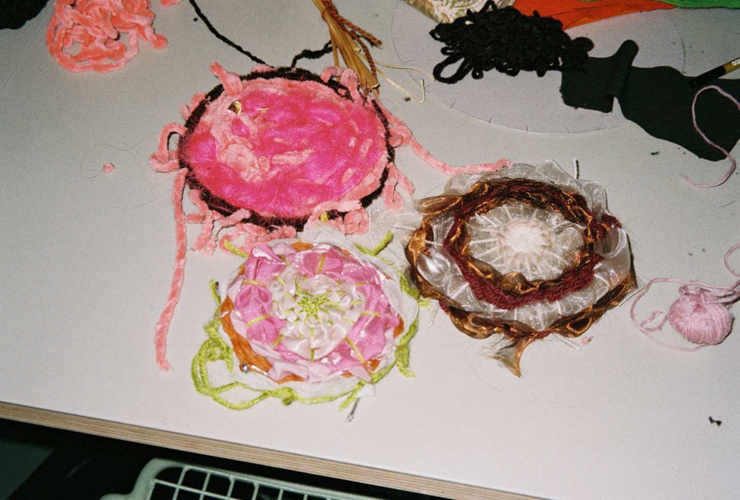 Handicrafts made by young people during a workshop. Photograph.