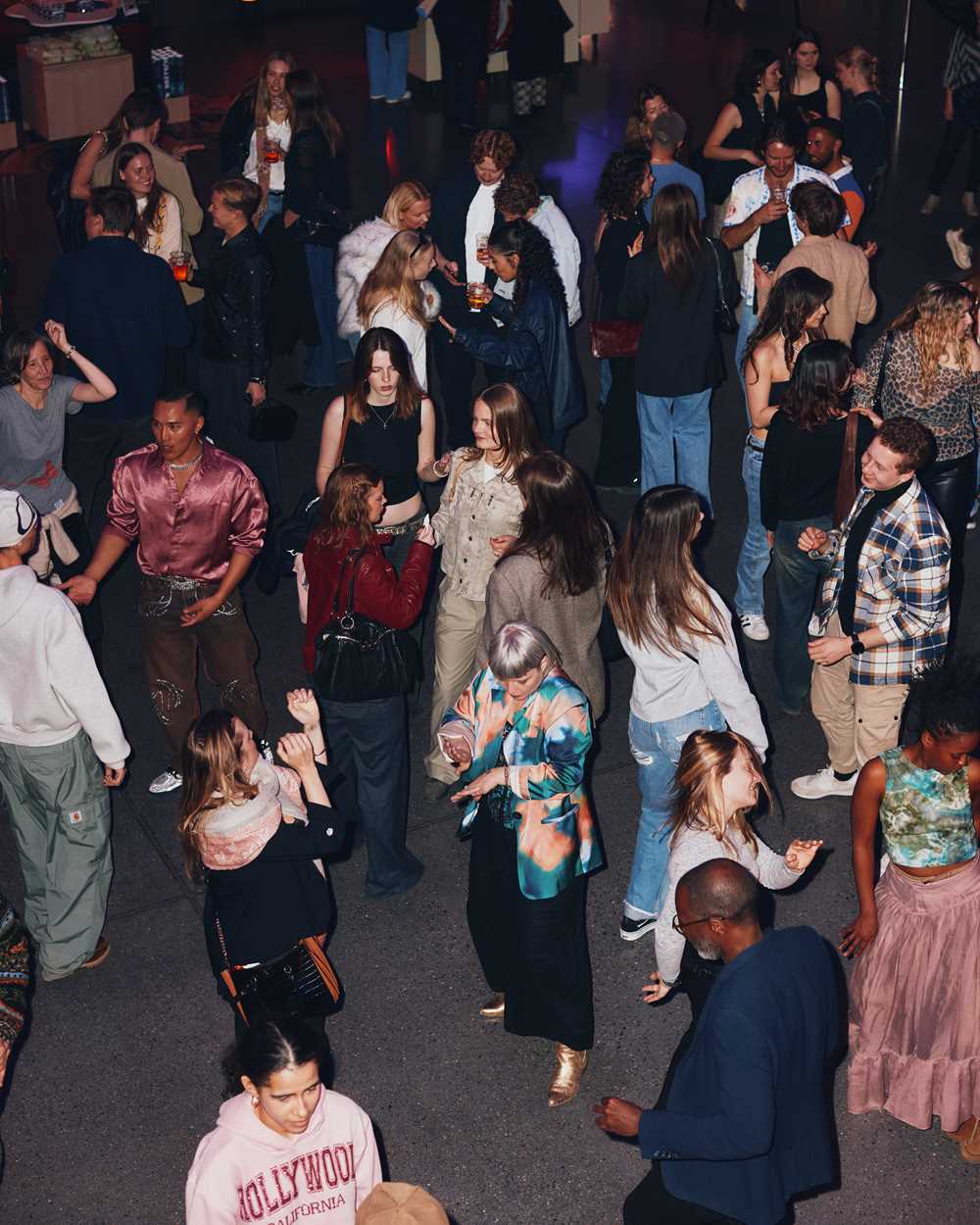 A full dance floor seen from above. Photograph.