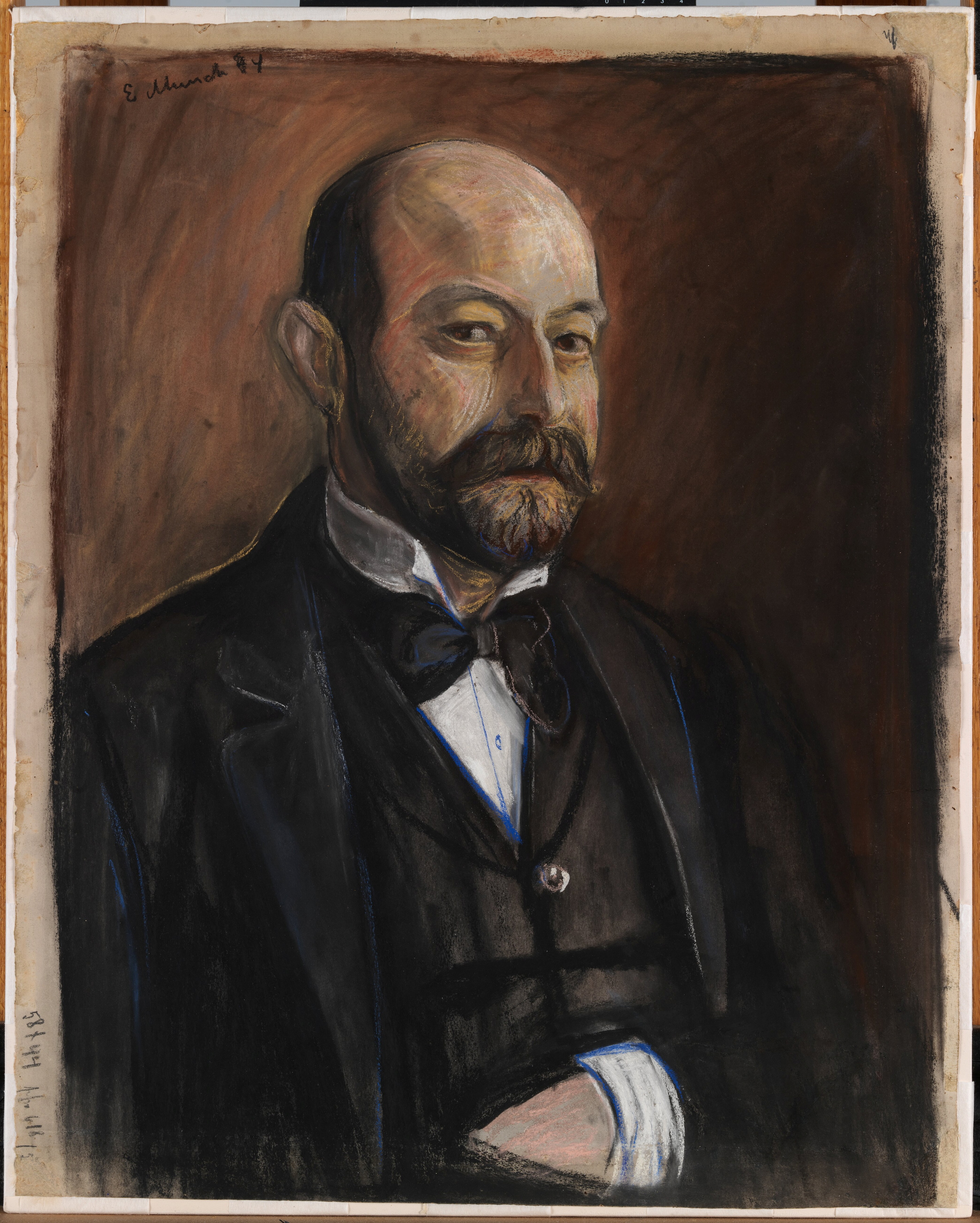 A half-length portrait of a middle-aged man with a moustache and beard, and a bald head. He is smartly dressed in a black jacket, waistcoat, white shirt, and black bow tie. He looks directly at the viewer with a clear and steady gaze. Painting.