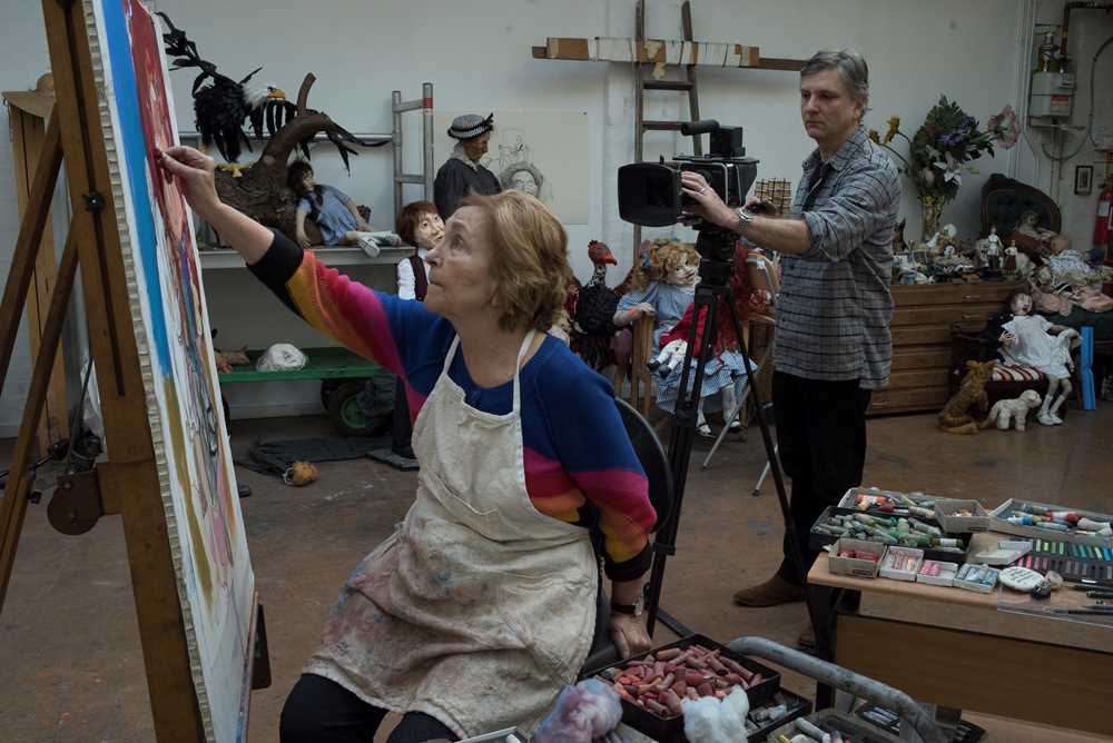 Photo of Paula Rego painting in her studio. 